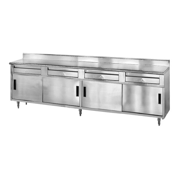An Advance Tabco stainless steel work table with drawers.