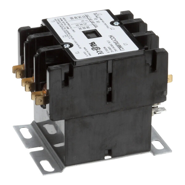 A close-up of a black and white Wells 3-pole contactor