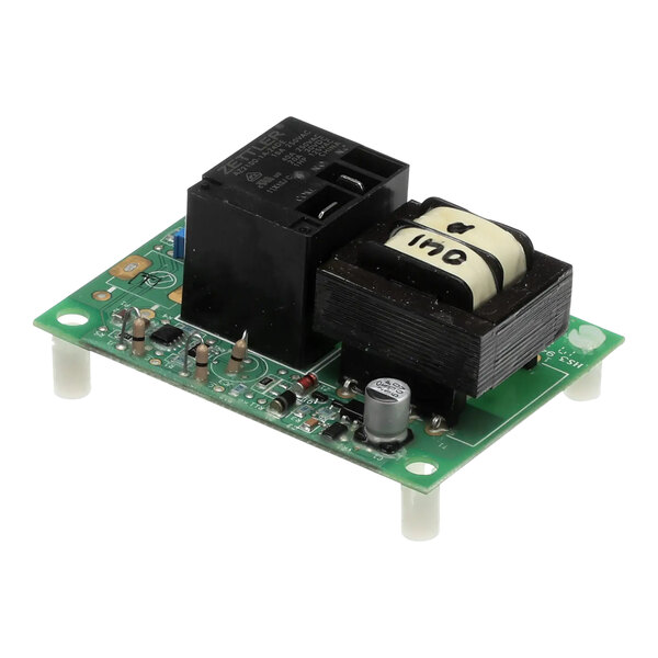 A close-up of a Wells temperature control module with a green circuit board.