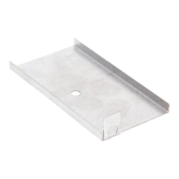 A metal bracket with a hole for a Wells shield bulb.