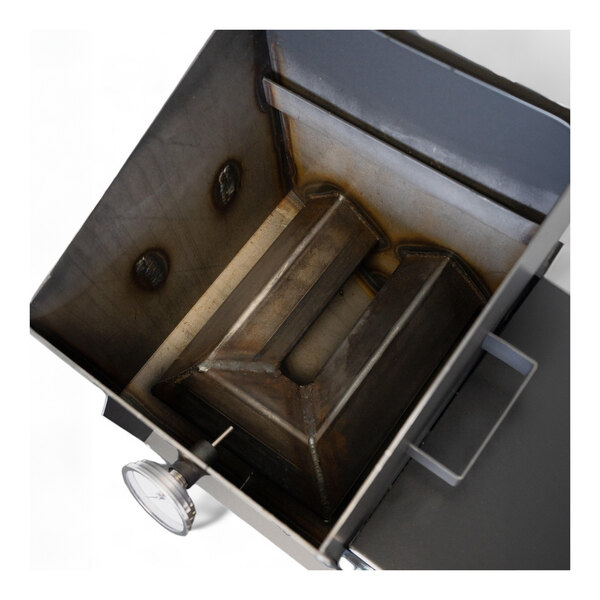 A metal box with a dial on the front and a hole in the middle.