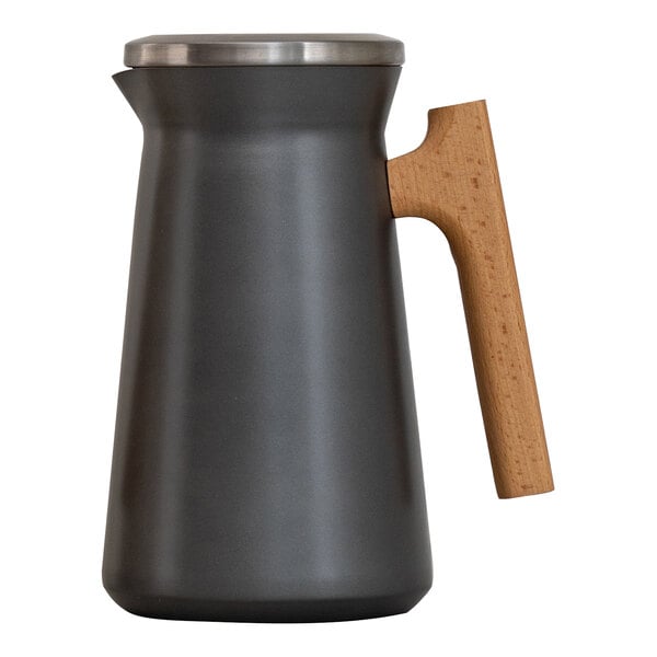 A grey stainless steel vacuum insulated coffee server with wood handle.