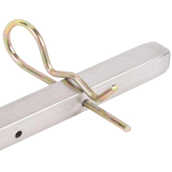 A metal spit with a metal hook on the end.