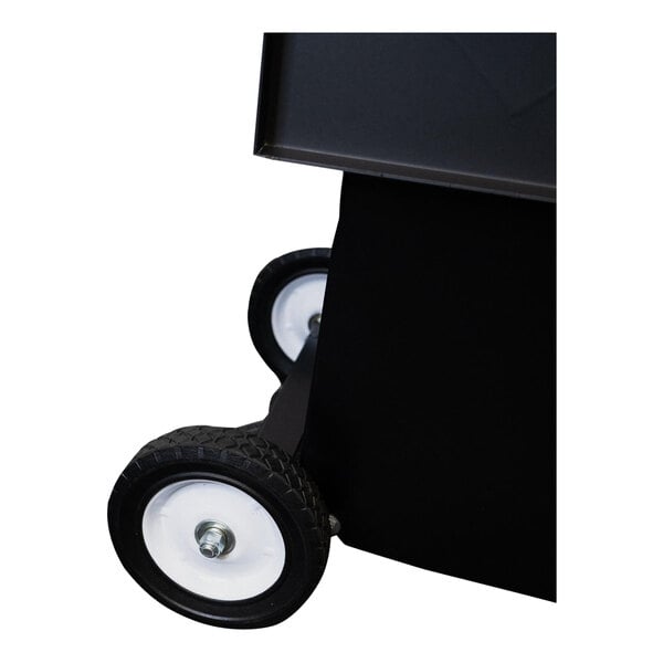 A close-up of a black and white wheel on a black box.