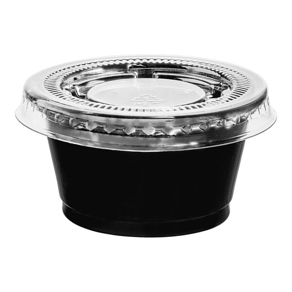 A black plastic souffle cup with a clear plastic lid.