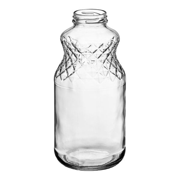 A clear glass juice bottle with a diamond pattern.