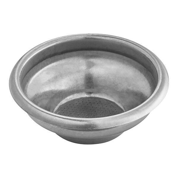 A silver stainless steel coffee filter with a perforated surface and a hole in the middle.