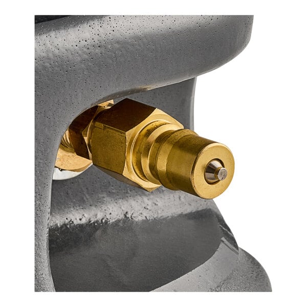 A brass valve on a metal pipe.