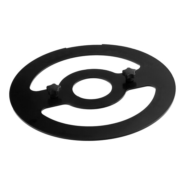 A black circular blade removal tool with two holes.
