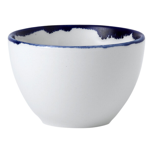 A white Dudson China bowl with a blue rim.