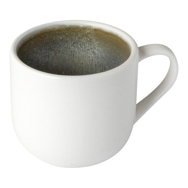 A white Bon Chef Tavola mug with a brown liquid inside.