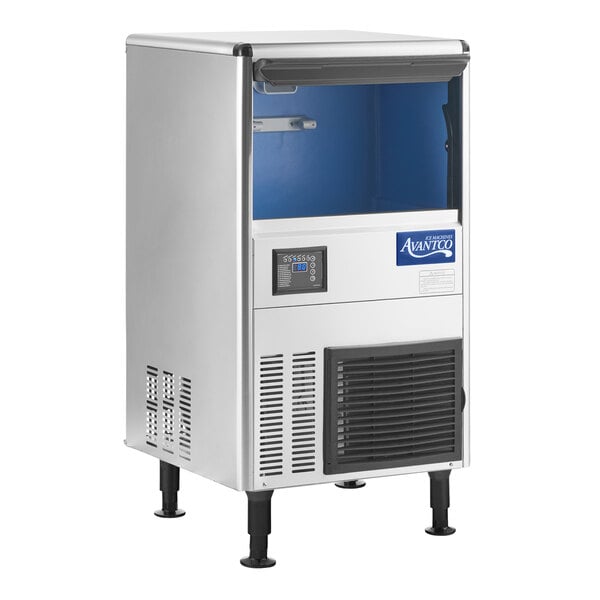 A stainless steel undercounter ice machine with a front control panel, open storage bin, and adjustable legs.