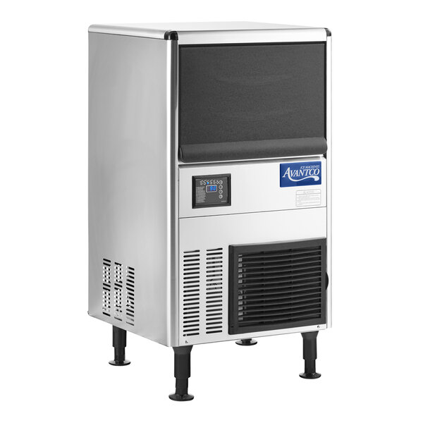 A stainless steel undercounter ice machine with a black front panel, digital control display, and vented lower section, standing on four adjustable legs.