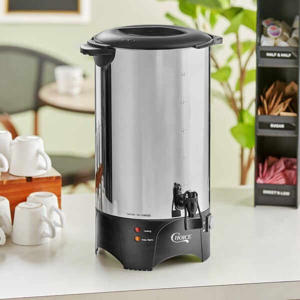 A large stainless steel single wall coffee urn with a black base and spigot, designed to hold up to 100 cups.