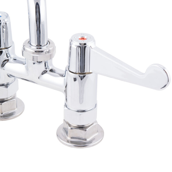 A chrome Equip by T&S deck-mounted faucet with wrist handles and a swing spout.