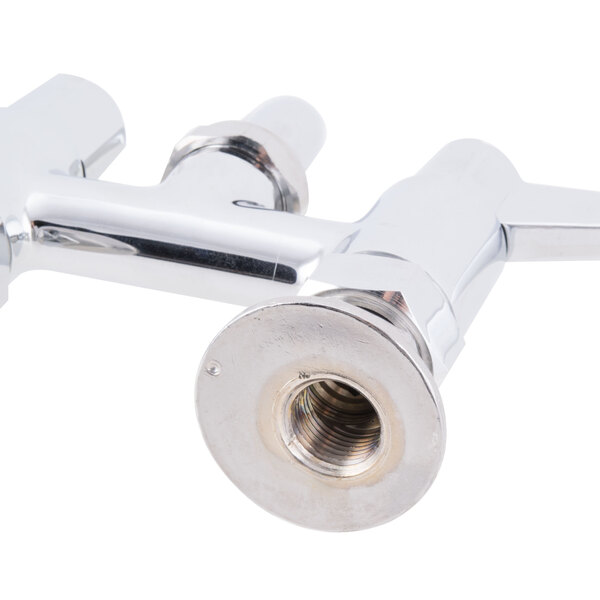 A close-up of a chrome deck-mounted Equip by T&S faucet with wrist handles.