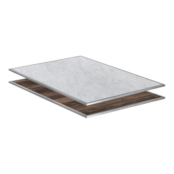 An Eastern Tabletop rectangular marble laminate drop-in tile with a silver edge on a white table.