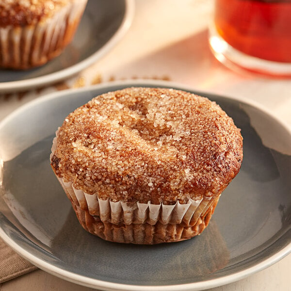 An OMG...It's Gluten Free banana chocolate chip muffin on a plate.