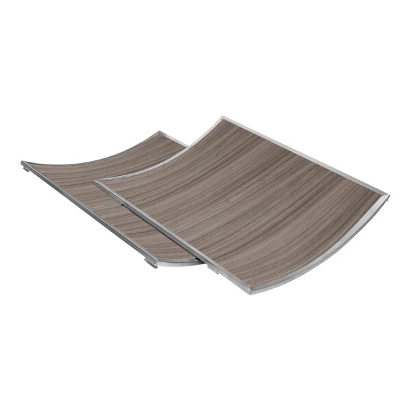 An Eastern Tabletop curved gray grain laminate side panel with a stainless steel edge.