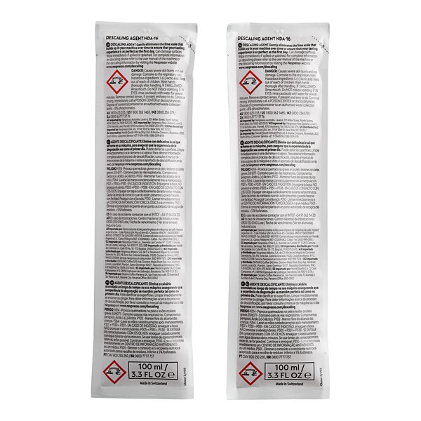 A white package with black text and red symbols for Nespresso Descaling Kit.