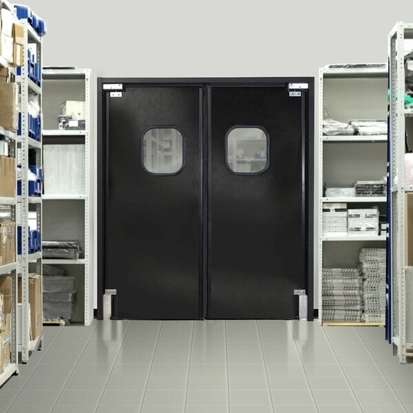 A black Aleco rigid double swinging traffic door with windows.