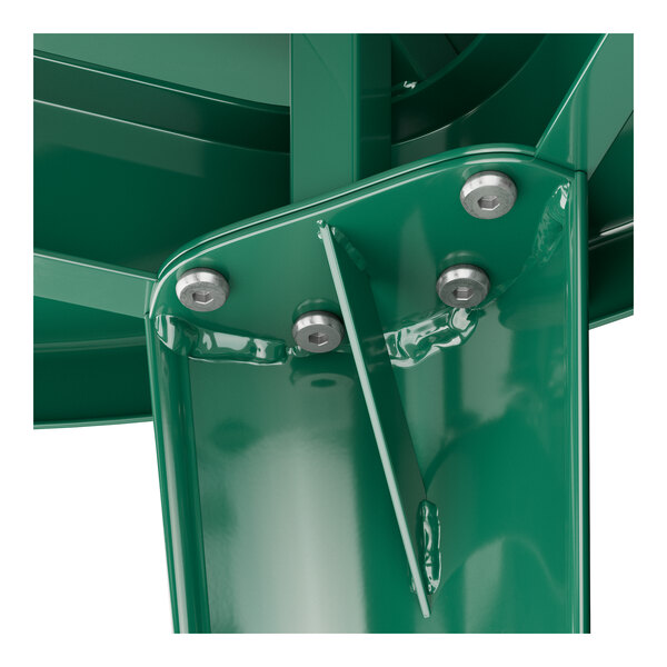 A close-up of a green metal surface with screws.