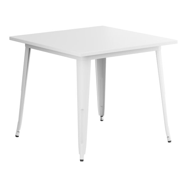 A Lancaster Table & Seating pearl white table with metal legs.