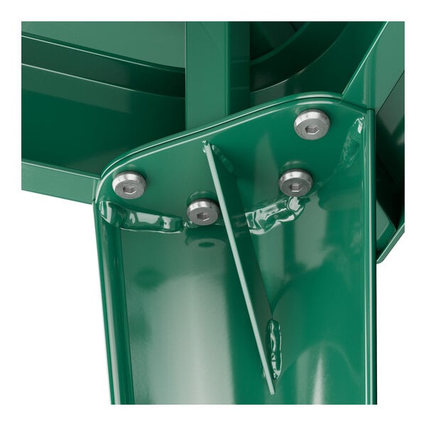 A close-up of a green metal surface with a Lancaster Table & Seating green metal table base.