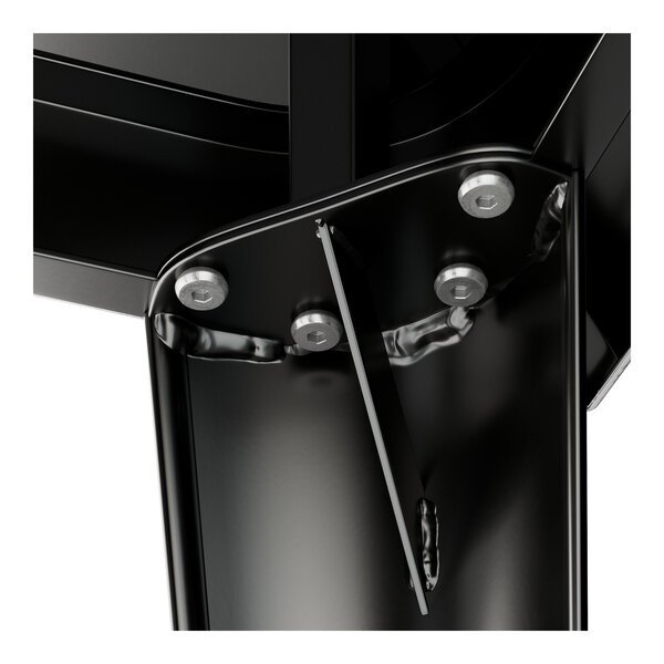 A close-up of a black metal Lancaster Table and Seating outdoor table top.