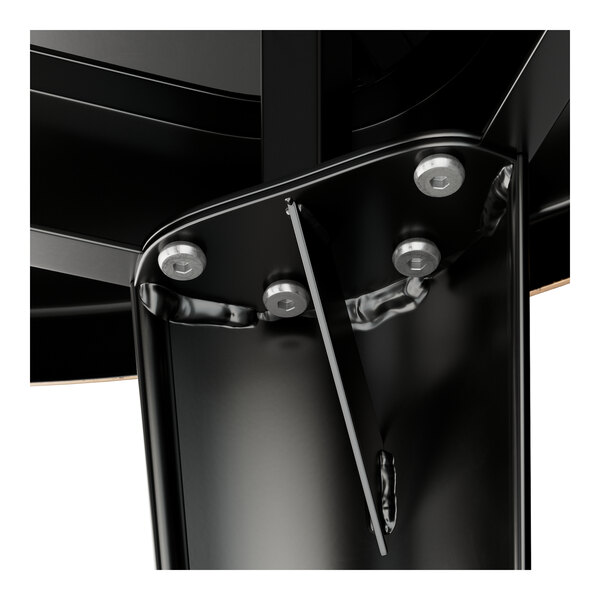 A close-up of the black metal Lancaster Table & Seating Alloy Series bar height table top.