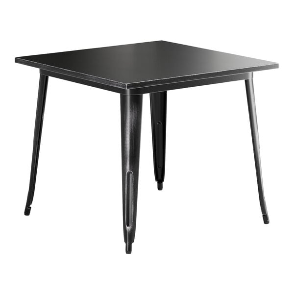 A Lancaster Table & Seating distressed onyx black square table with metal legs.