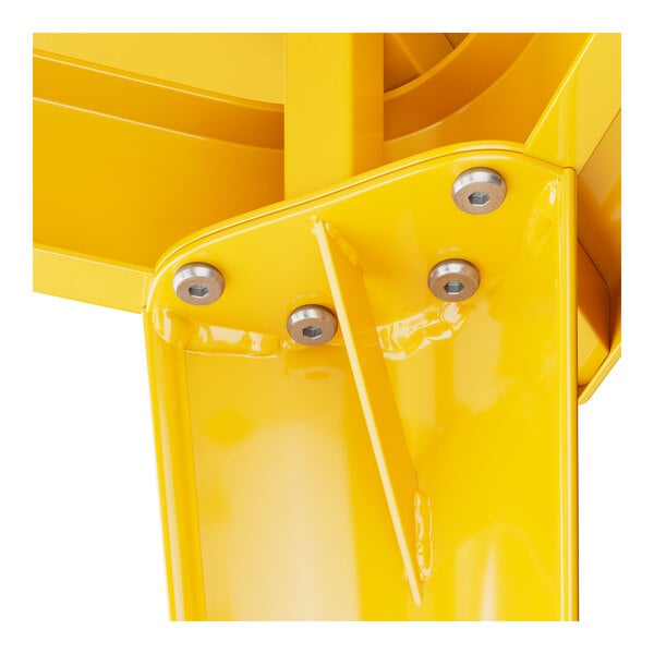 A close up of a yellow metal Lancaster Table & Seating table piece.