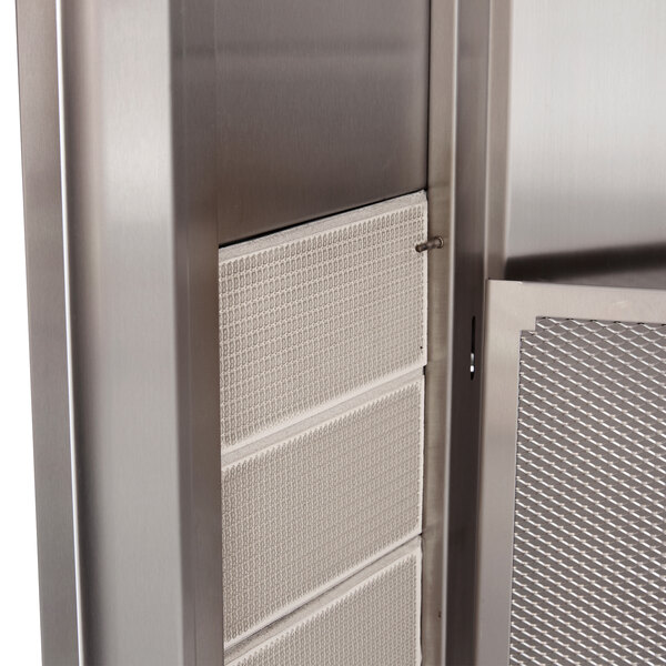 The stainless steel door with a mesh screen on a Visvardis Turbo Gas Gyro Machine.