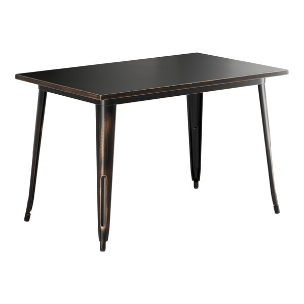 A Lancaster Table & Seating Alloy Series outdoor table with distressed copper legs and a black top.