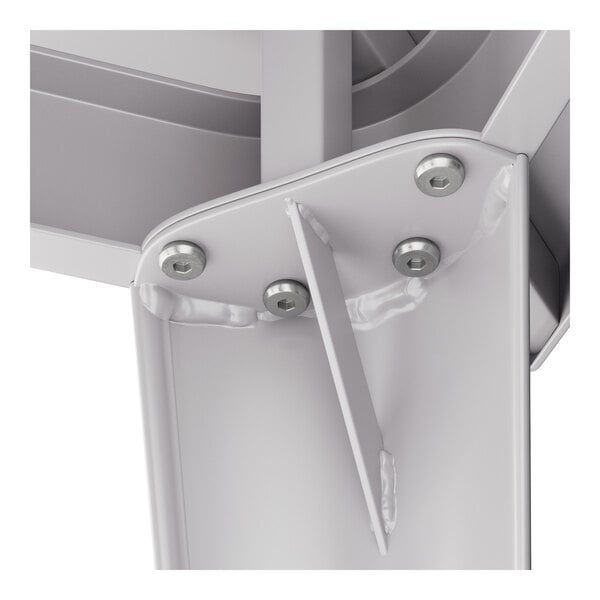 A close-up of a metal bracket with screws from a Lancaster Table & Seating Alloy Series bar height table.