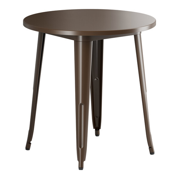 A Lancaster Table & Seating round copper table with metal legs.