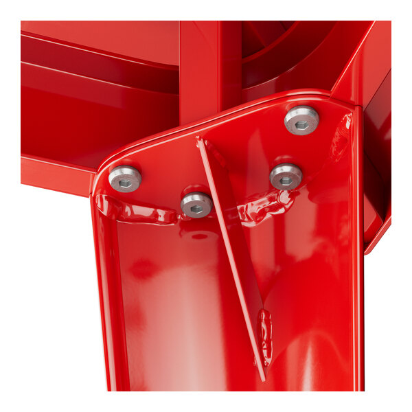 A close-up of a red metal Lancaster Table & Seating bar height table base.