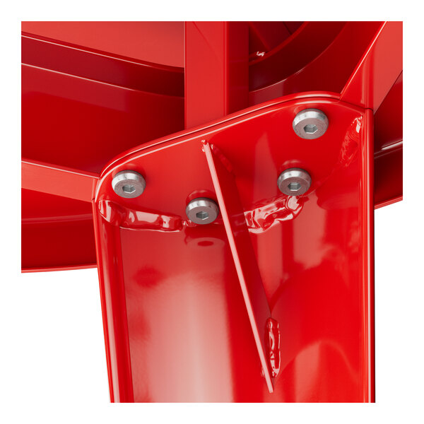 A close-up of a red metal Lancaster Table & Seating table base.