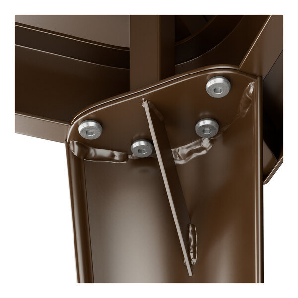 A close-up of a Lancaster Table & Seating copper metal structure with bolts.