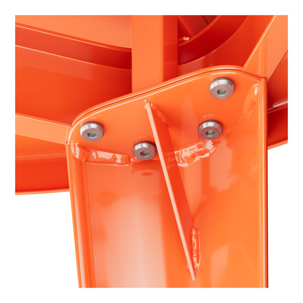 A close-up of a Lancaster Table & Seating metal piece with orange accents.
