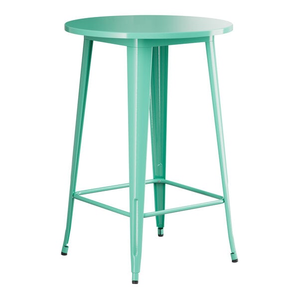 A Lancaster Table & Seating aquamarine metal table with a round top.