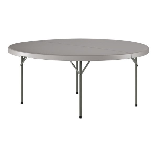 A large round gray folding table with metal legs.