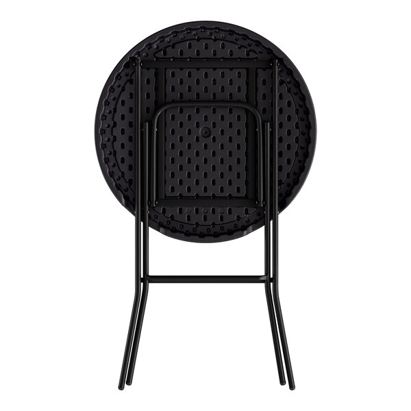 A round black heavy-duty plastic folding table with black legs shown in a folded position.