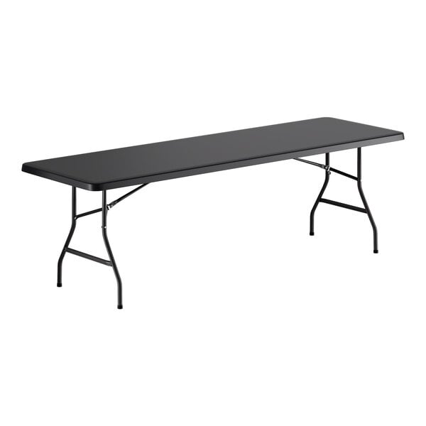 A large black heavy-duty blow molded plastic folding table with black metal legs.