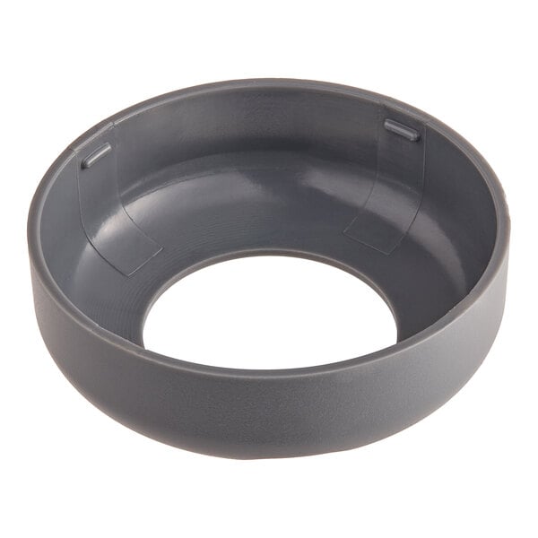 A gray circular flange cover with a white circle and hole in it.
