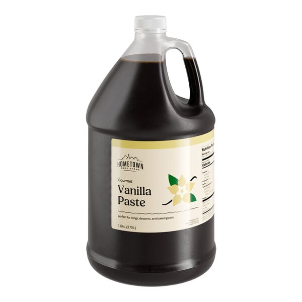 A black jug of Hometown Provisions Vanilla Bean Paste with a white label.