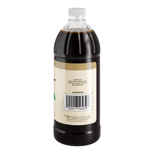 A close up of a Hometown Provisions Imitation Vanilla bottle filled with dark liquid.