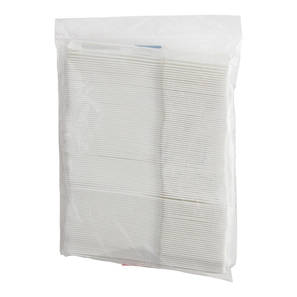 A white plastic bag with white World Centric knife refill sleeves inside.