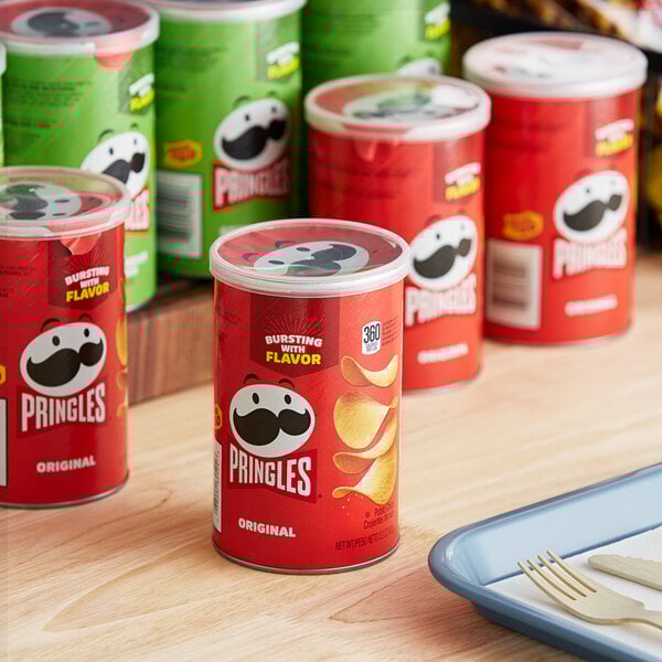 A close up of a red container of Pringles potato chips.