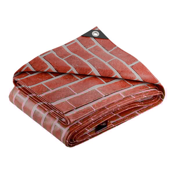 A folded black and brick red CORE Heavy Duty Tarp with a brick pattern on the outside.